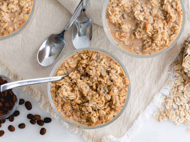 Two bowls of coffee overnight oats and coffee beans