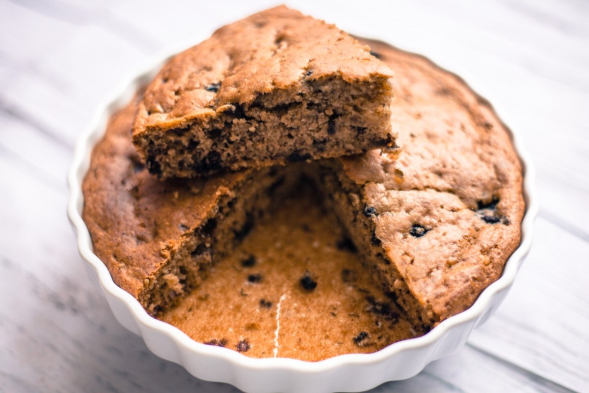 An oatmeal yogurt cake in a cake pan.