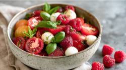 Bowl of tomato and raspberry salad